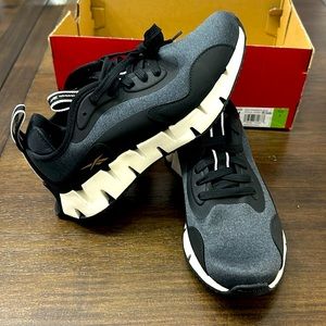 NWT in box. Women’s Zig Dynamic size 7, Reebok running shoe. Color Black/Chalk